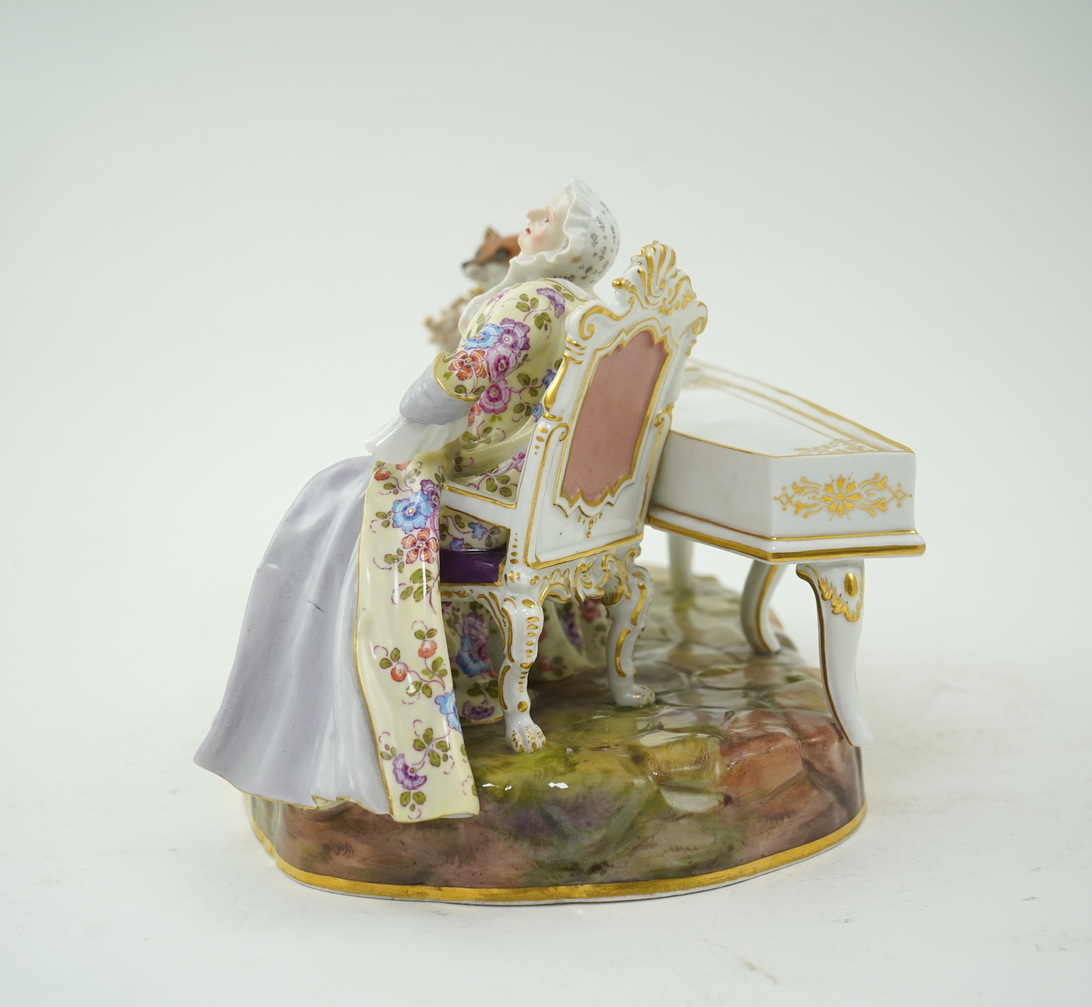 A Meissen group of a fox at the piano and a lady listening, after J. J. Kandler, late 19th century